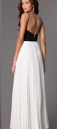 a woman in a white and black long dress