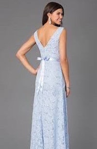 the back of a woman in a light blue lace dress