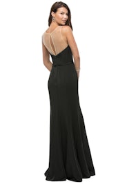 the back view of a woman in a black evening gown
