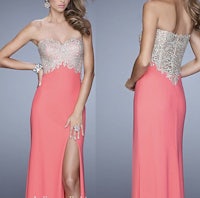 a woman in a pink prom dress with a slit