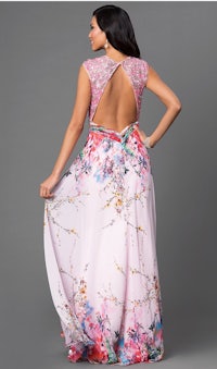 the back of a woman in a pink floral dress