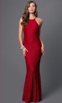 a woman wearing a red lace gown