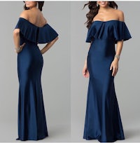 a woman in a navy off the shoulder gown with ruffles