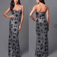 a woman in a black and silver dress