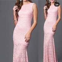 a woman in a pink lace dress is posing for a photo