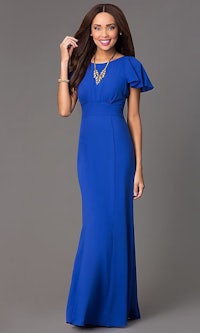 a woman in a blue dress with ruffled sleeves