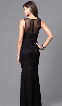 a woman in a black lace dress with a sheer back