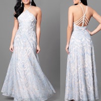the back view of a woman in a blue lace dress