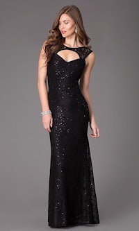 a woman in a black lace dress with a slit