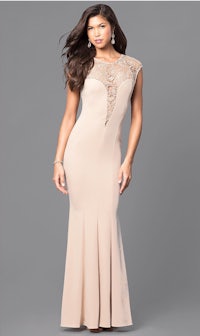 a woman wearing a nude evening gown