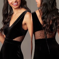 a woman wearing a black velvet dress with lace detailing