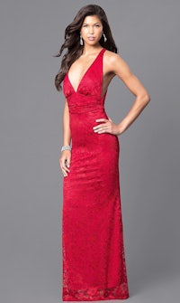 a woman in a red lace dress posing