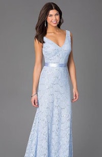 a woman wearing a light blue lace dress