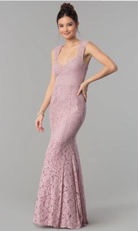 a woman wearing a lace mermaid gown in lavender