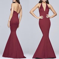 the back view of a woman in a burgundy mermaid gown