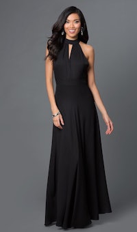 a woman in a black gown with a halt neckline
