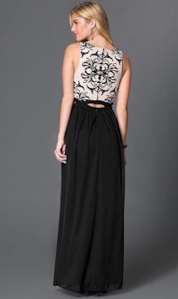 the back of a woman in a black and beige maxi dress