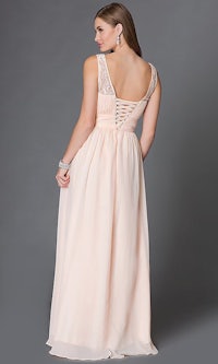 a woman wearing a blush colored prom dress with a v - neckline and beading