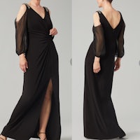 a woman in a black dress with a sheer sleeve and slit