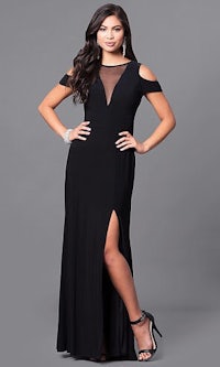 a woman in a black dress with a slit