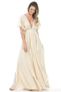 the model is wearing a cream chiffon maxi dress
