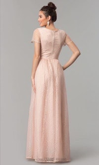 the back of a woman wearing a blush lace evening dress