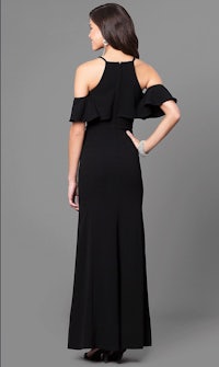 the back of a woman in a black dress with ruffles