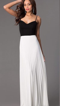 a woman in a white and black long dress
