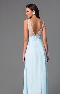 the back of a woman in a light blue prom dress