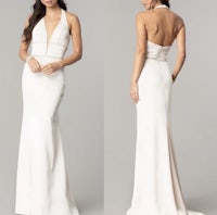 the back view of a white gown with a halter neck