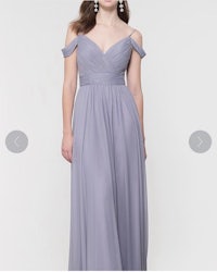 the bridesmaid is wearing a grey dress