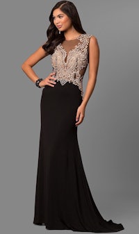 a woman wearing a black and gold evening gown
