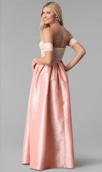 a woman in a pink off the shoulder prom dress