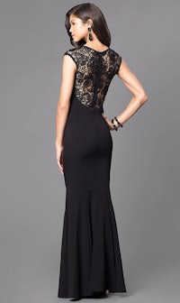 the back of a woman in a black lace dress